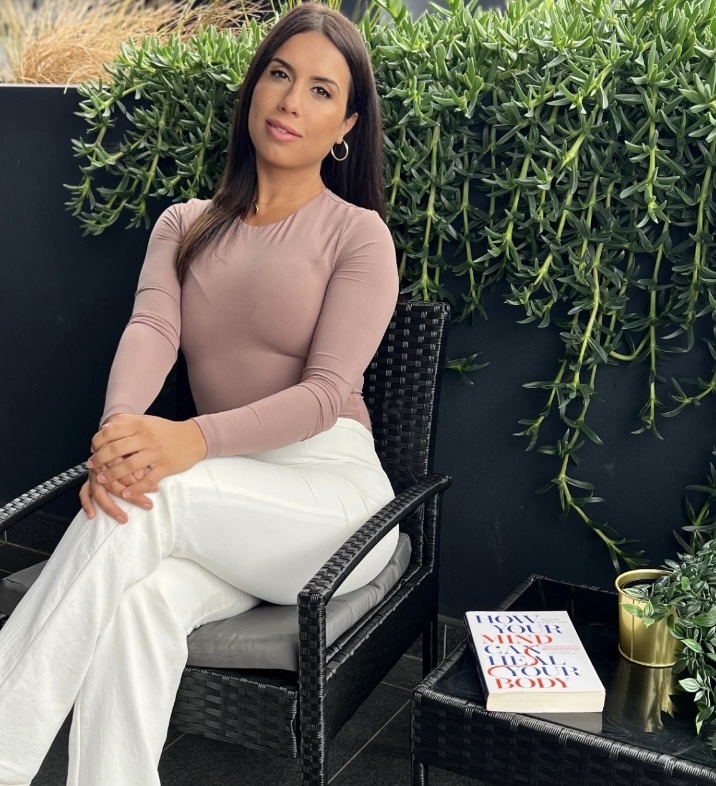 Jana sitting outdoors